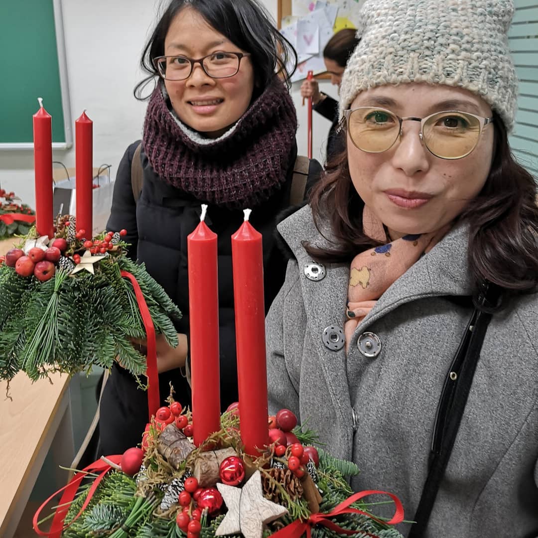 Participants with their winter floral arrangements